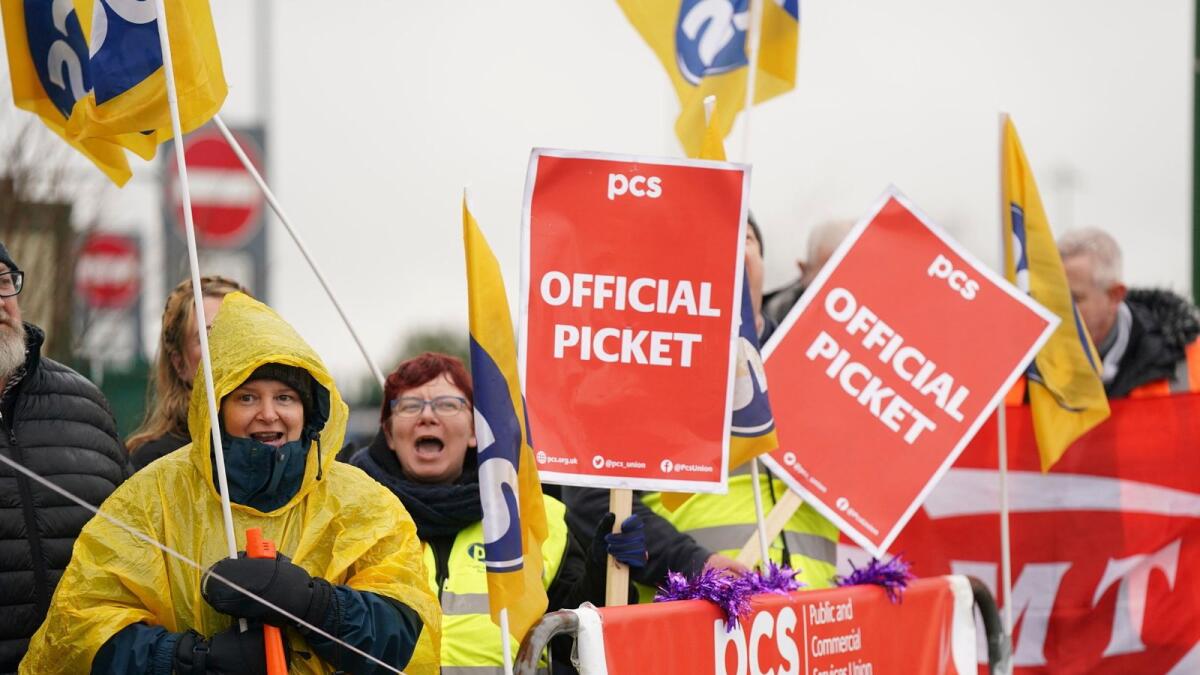 Members of the Public and Commercial Services union on the picket line outside Birmingham Airport. — AP