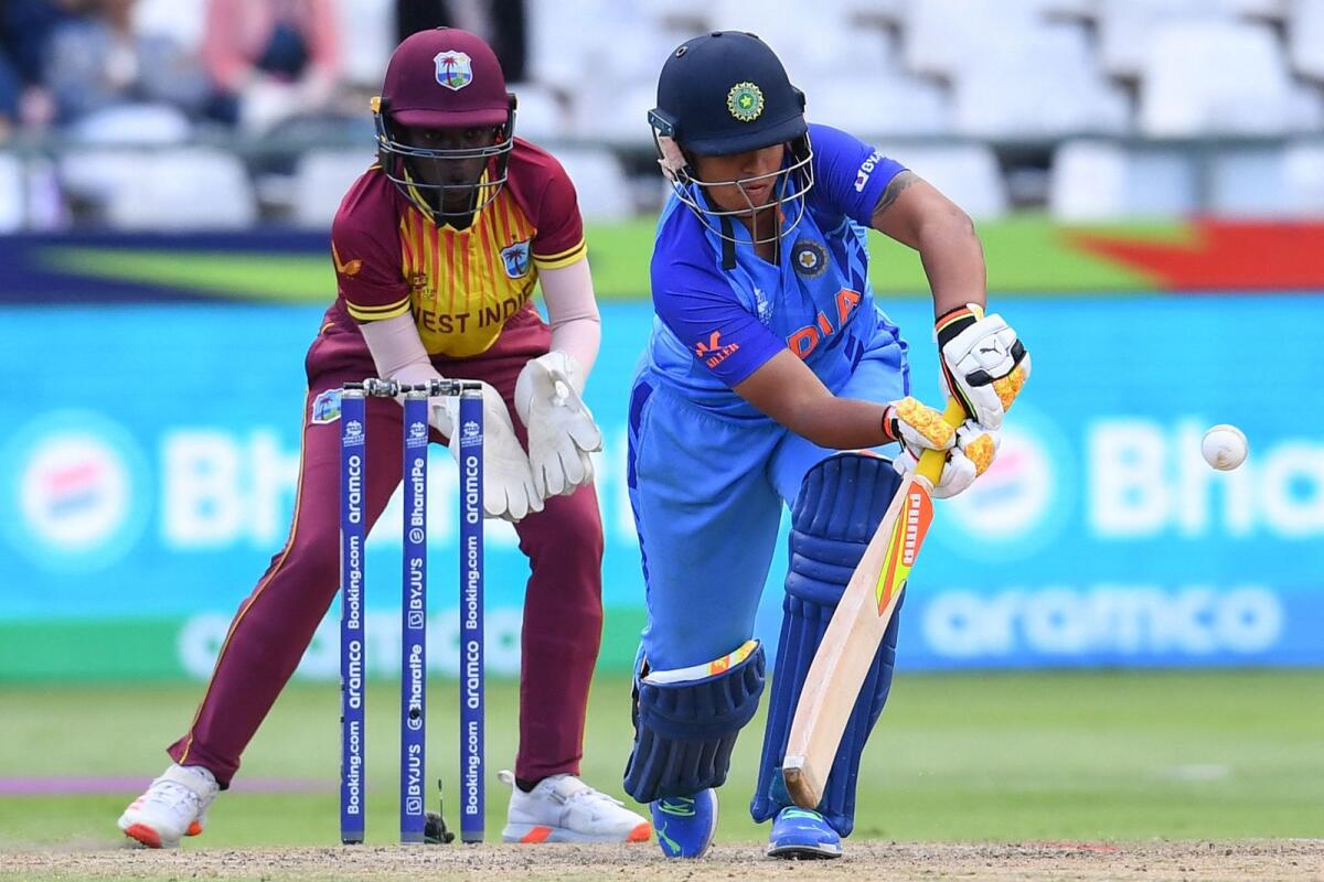 India's Richa Ghosh (right) plays a shot against the West Indies in the T20 Women's World Cup at Newlands Stadium in Cape Town on Wednesday. — AFP