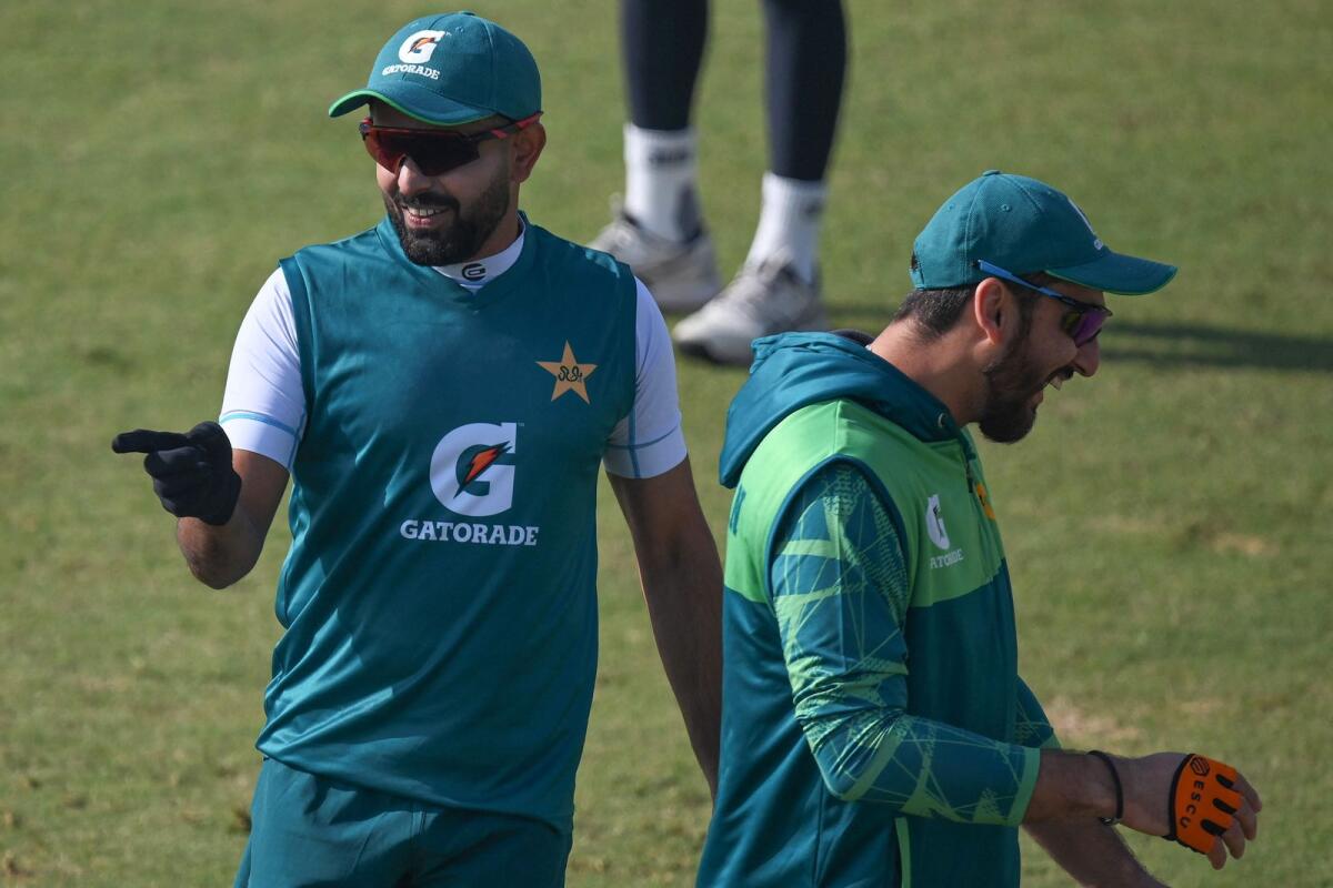 Pakistan's Babar Azam (left) and Agha Salman attend a practice session in Rawalpindi. — AFP