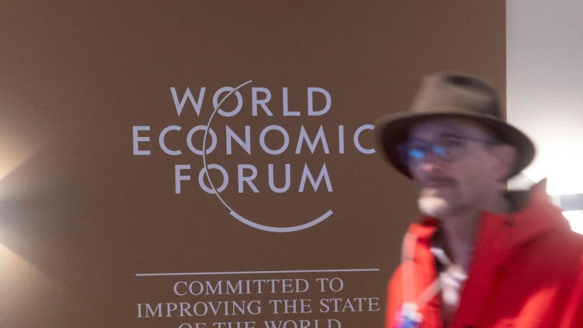 A man walks past the logo of the World Economic Forum (WEF) 2023 at Davos Congress Centre in the Alpine resort of Davos, Switzerland. — Reuters