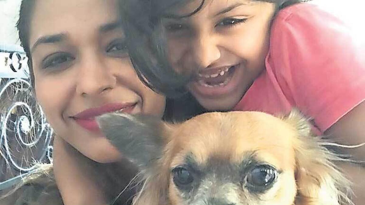 Ammeeya K Rao’s pet Ginger with his daughter Aashi and wife Rythym. — Supplied photo