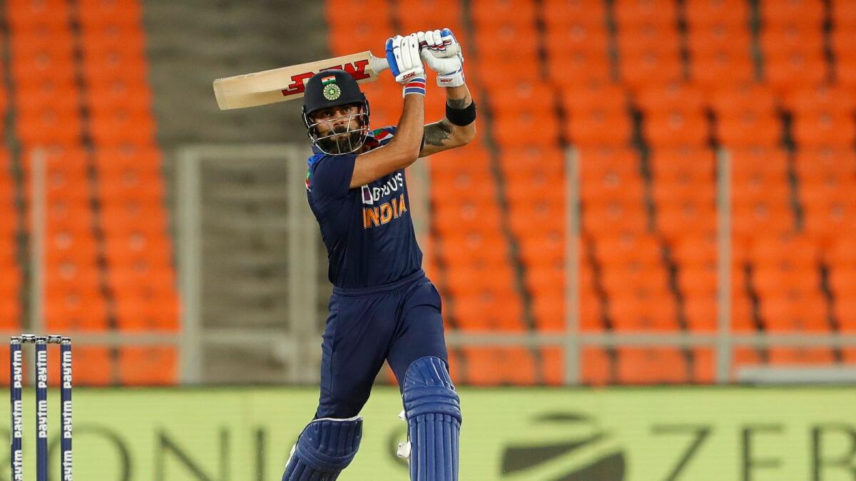 Virat Kohli hits a boundary during the third T20 International against England. (BCCI)