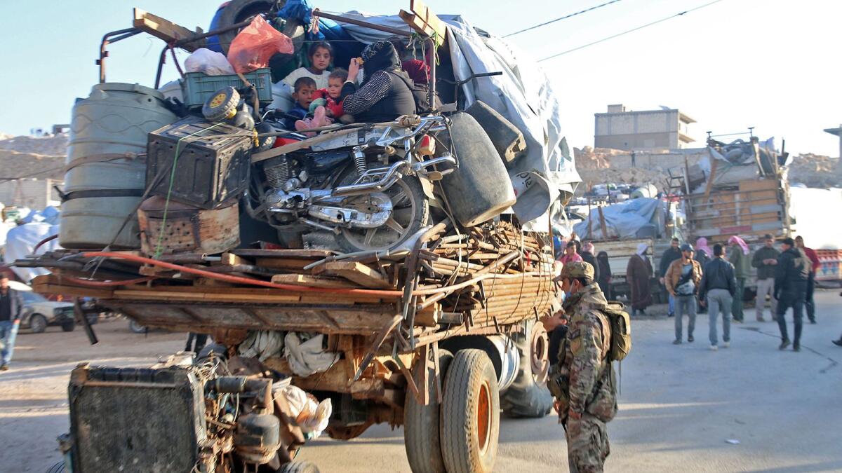 Syrians refugees prepare to leave Lebanon towards Syrian territory through the Wadi Hamid crossing in Arsal on October 26, 2022. — AFP file