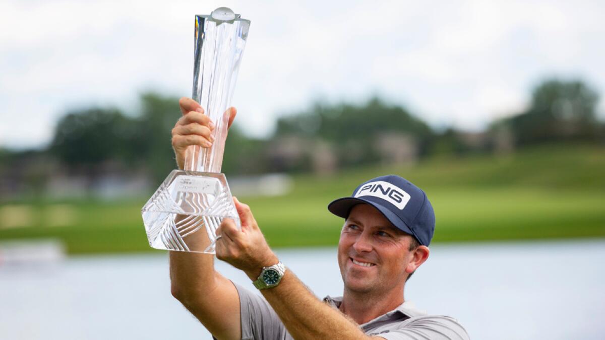 Michael Thompson holds the trophy after winning the 3M Open golf tournament in Blaine, Minnesota, on Sunday, July 26, 2020. Photo: AP