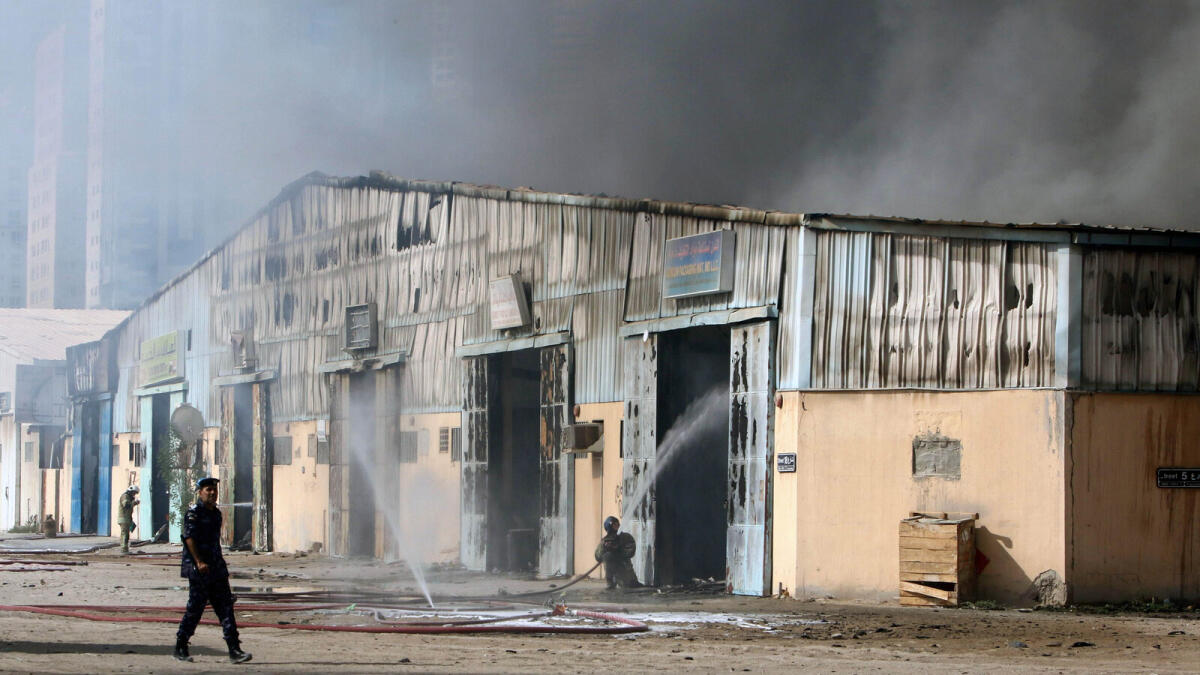 Firefighter battles blaze in Sharjah's Industrial Area.
