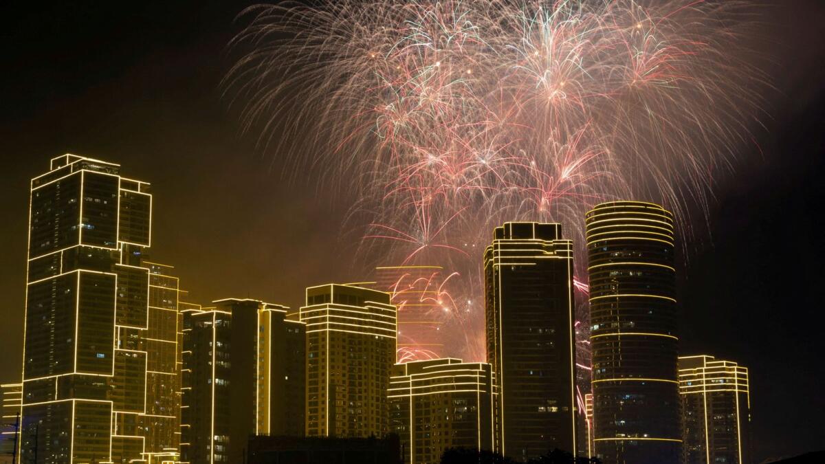 Photo: Fireworks explode over Rockwell Center in celebration of the New Year in Makati, Metro Manila, Philippines, January 1, 2024. Reuters