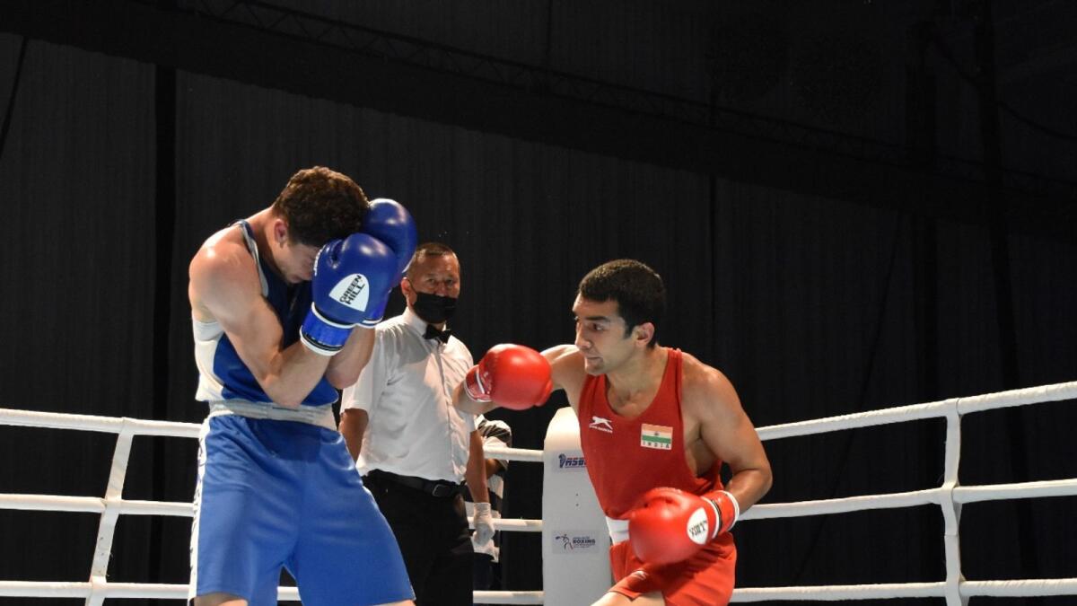 Shiva Thapa (right) punches Nader Odah during their fight in Dubai on Tuesday. (Supplied photo)
