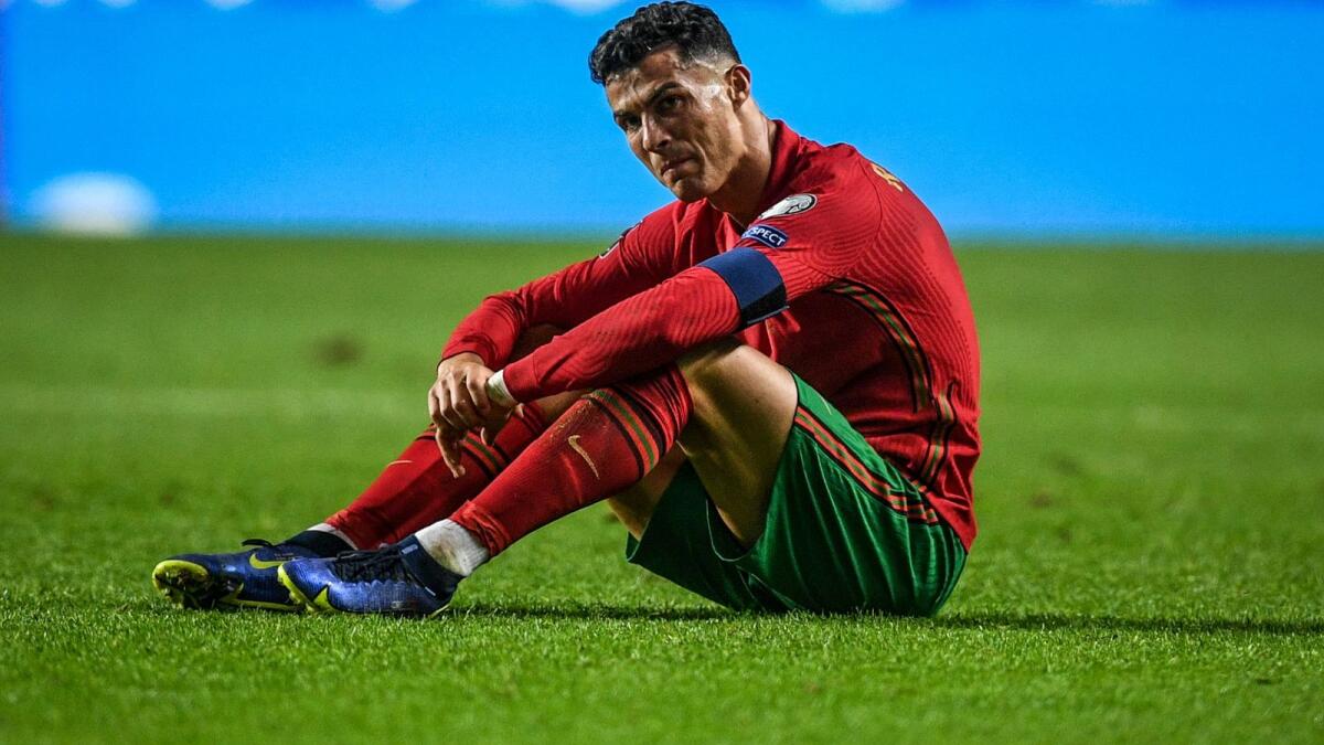 Portugal forward Cristiano Ronaldo reacts after losing to Serbia. (AFP)