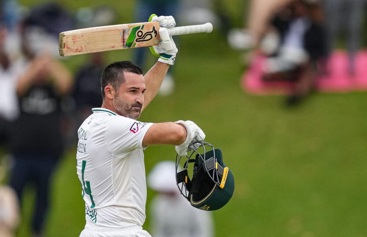 South Africa's Dean Elgar celebrates his century during the second day of the first Test against India. — PTI