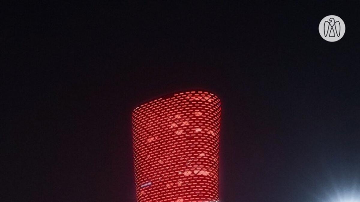 Abu Dhabi National Exhibitions Company, adnec, capital gate, tower, lights, up, Lebanese, flag, Beirut, blasts, gesture, solidarity
