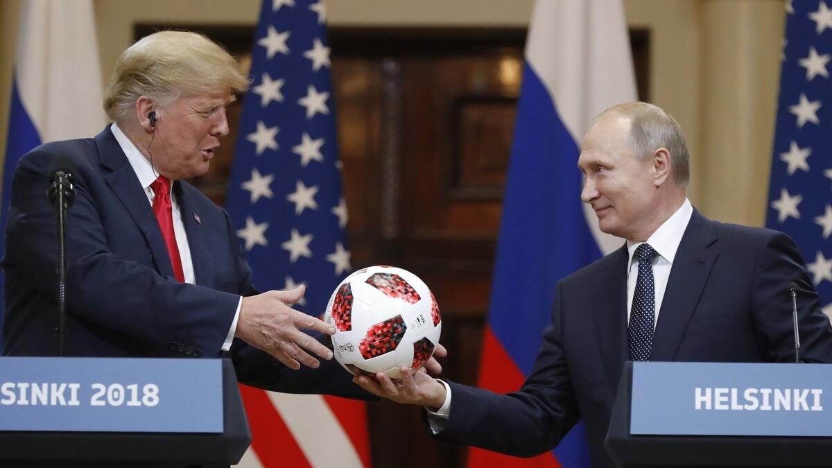 Football diplomacy: World Cup host Putin gives Trump a ball 