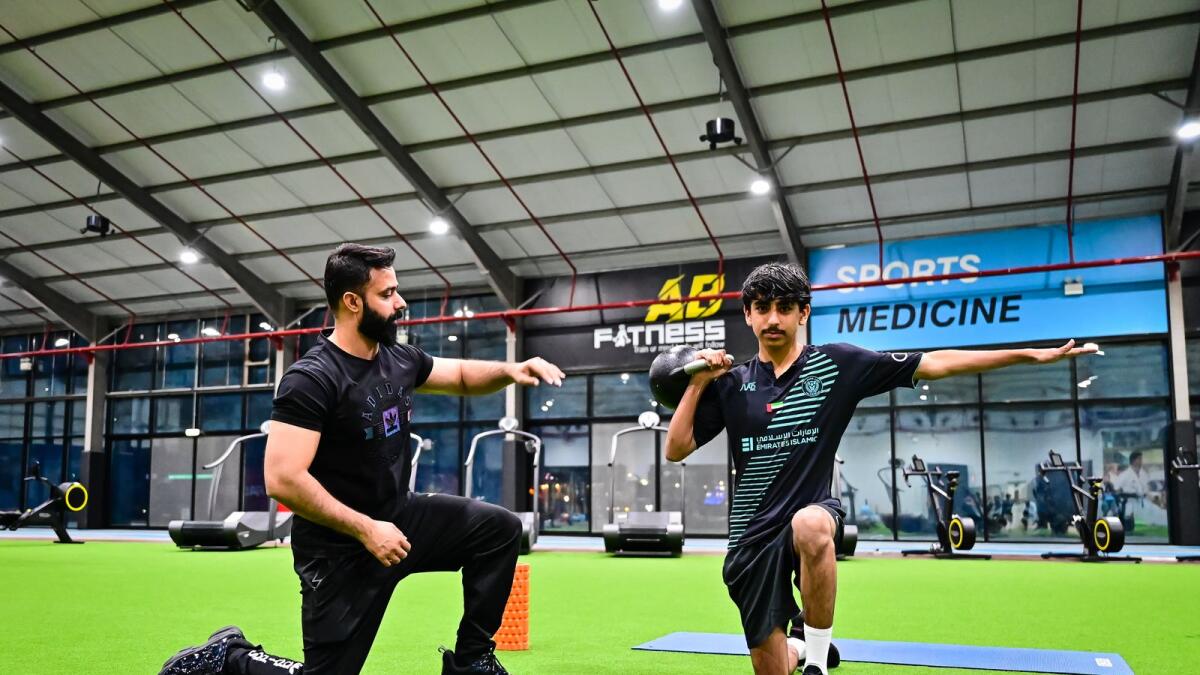 Personal trainer Shahbaz Haider trains Abdulla AlOlama at AB Fitness in Dubai.  Photo by Neeraj Murali.