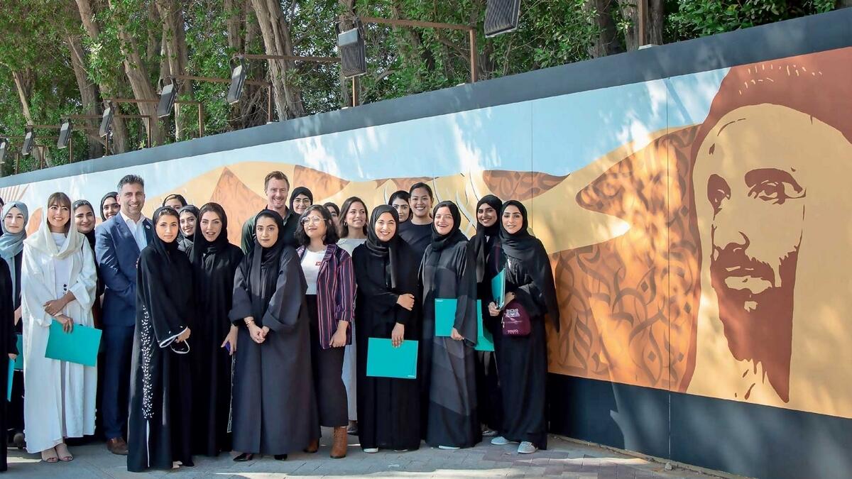 The Zayed University students in front of the mural dedicated to the UAE’s founding father.