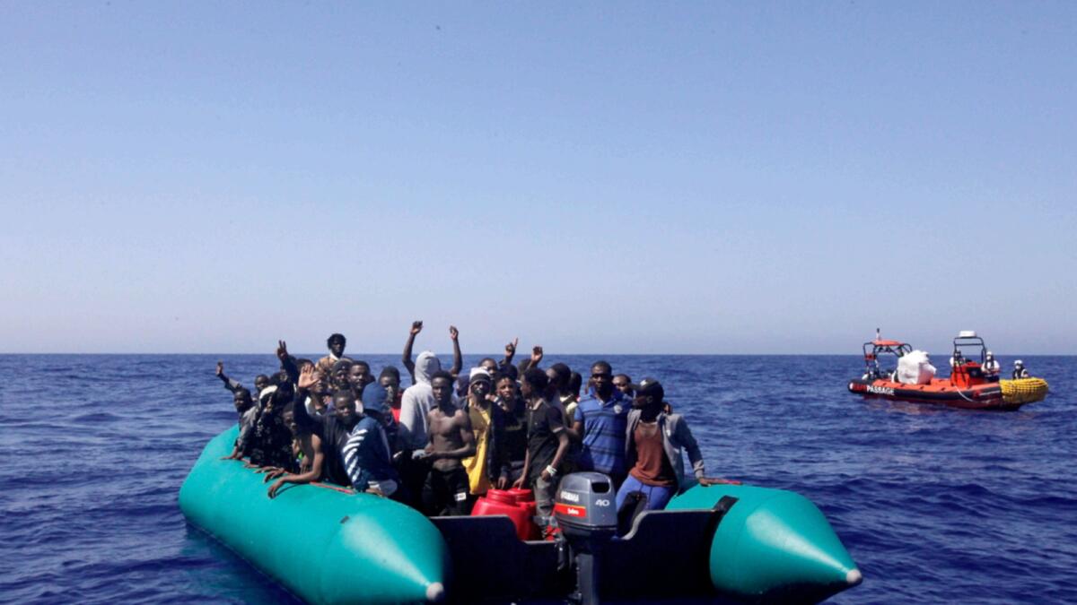 African migrants on a rubber boat in the Mediterranean Sea, off Libya are being rescued by the MV Geo Barents vessel of MSF (Doctors Without Borders) NGO, in the central mediterranean route. — AP