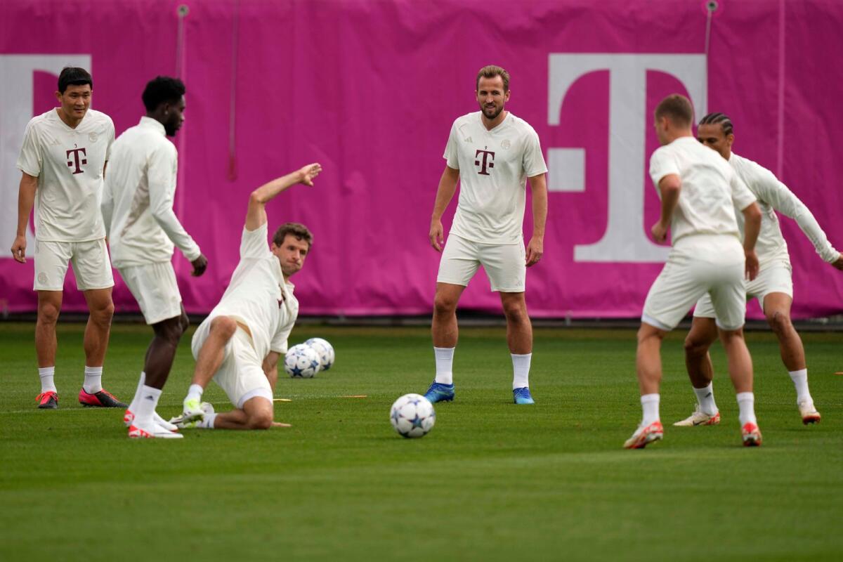 Bayern's Harry Kane (centre) with his teammates during a training session on Tuesday. — AP