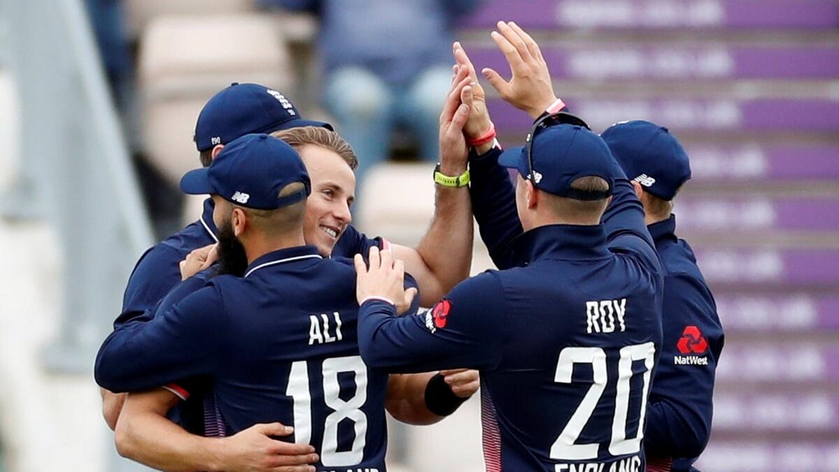Englands Tom Curran celebrates taking the wicket of West Indies Chris Gayle.-Reuters