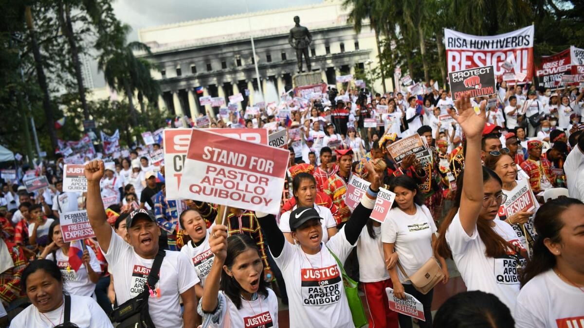Supporters of Apollo Quiboloy hold a prayer rally at a park in Manila on March 4. Photo: AFP file
