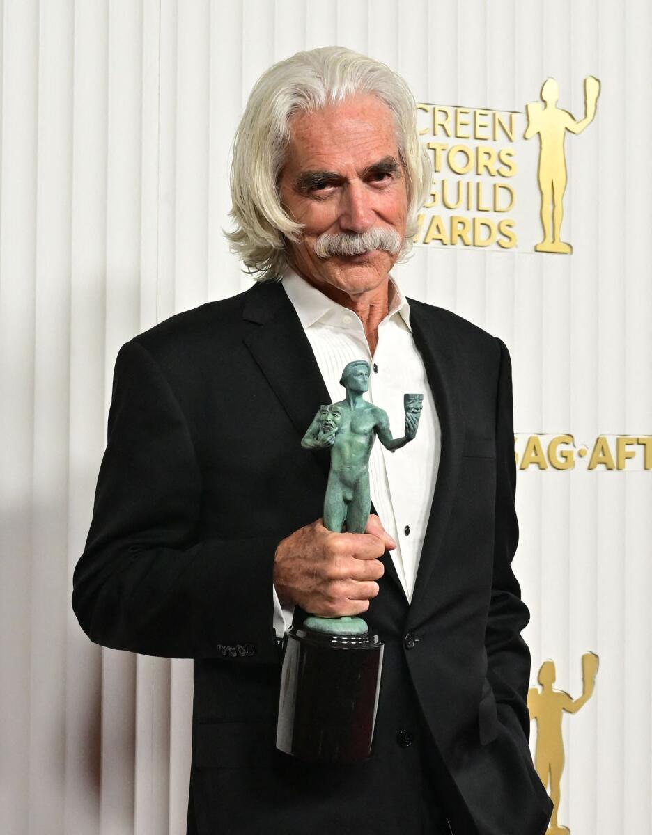 Elliott poses with the award for outstanding Male Actor in a TV Movie or Miniseries for '1883'