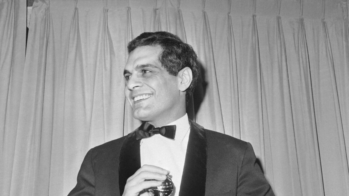 In this1966 file photo, actor Omar Sharif with his Golden Globe award for Best Actor for his role in Doctor Zhivago in Hollywood.