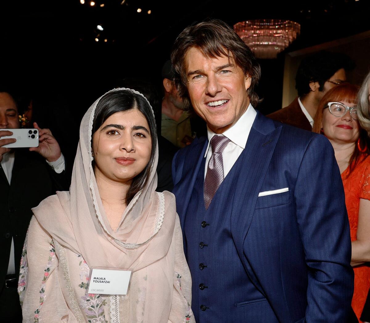 Pakistani activist Malala Yousafzai pictured with Tom Cruise