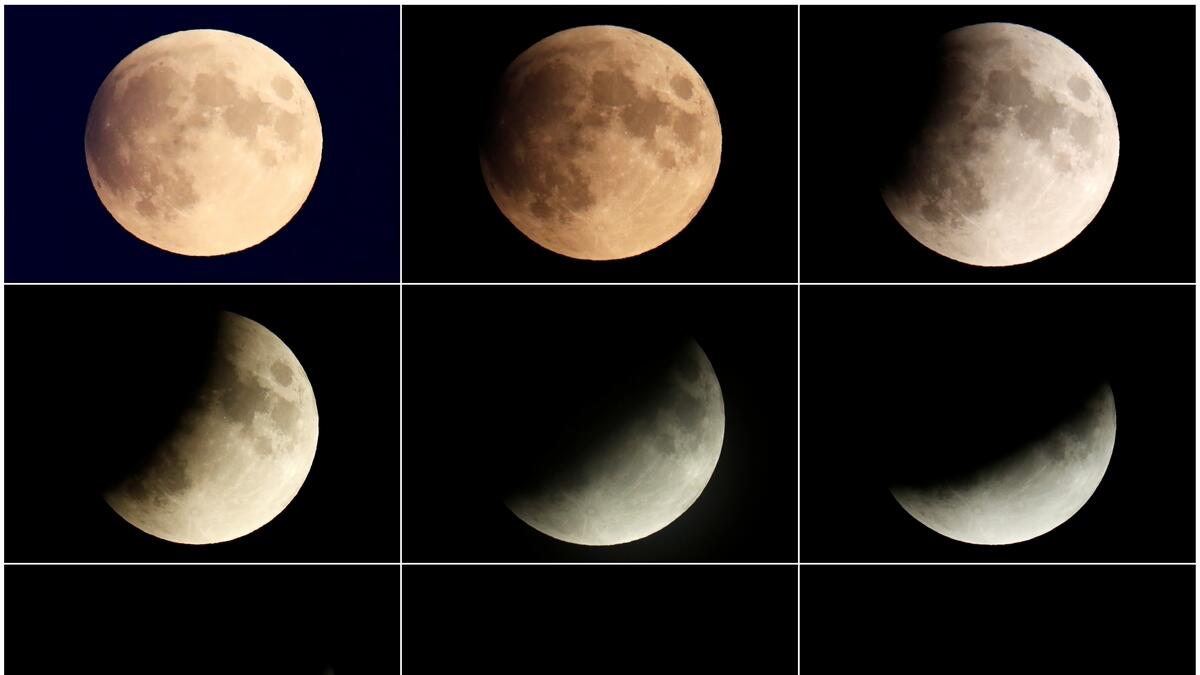 A combination of pictures shows the moon as it enters a partial lunar eclipse seen in Berlin, Germany. Reuters