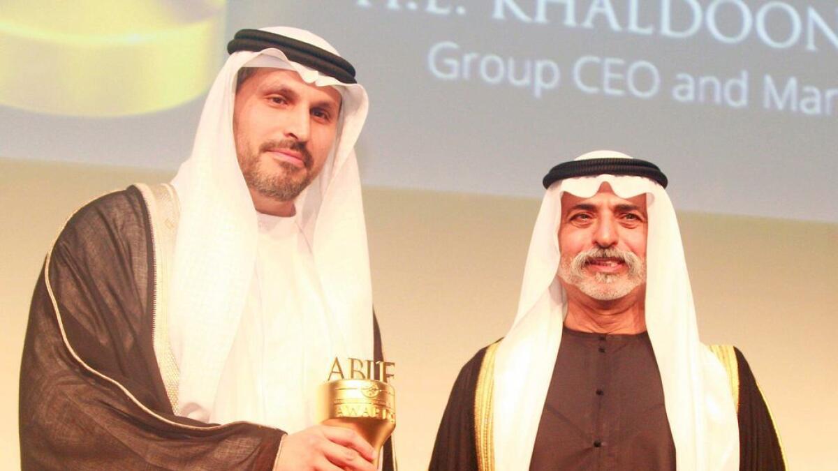 Khaldoon Khalifa Al Mubarak, Group CEO and Managing Director of Mubadala UAE receives the award from Shaikh Nahayan Mabarak Al Nahayan.-  Photo Mohammad Mustafa Khan/ Khaleej Times