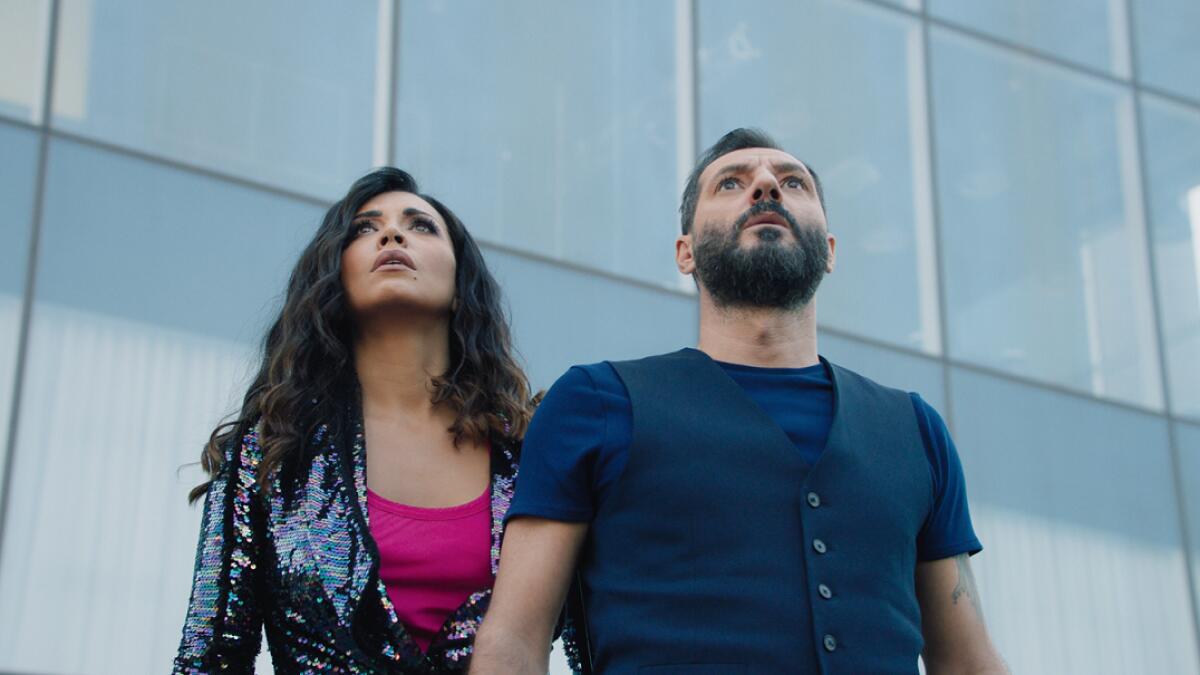 Amal Bouchoucha and Adel Karam in a scene from Netflix Arabic comedy Dollar