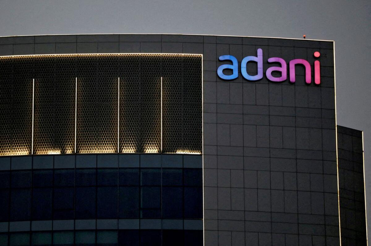 The logo of the Adani group is seen on the facade of one of its buildings on the outskirts of Ahmedabad, India. Photo: Reuters file