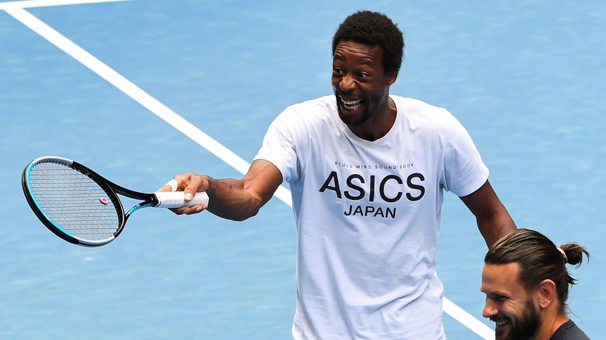 Gaels Monfils of France reacts during a practice session in Melbourne. — AFP