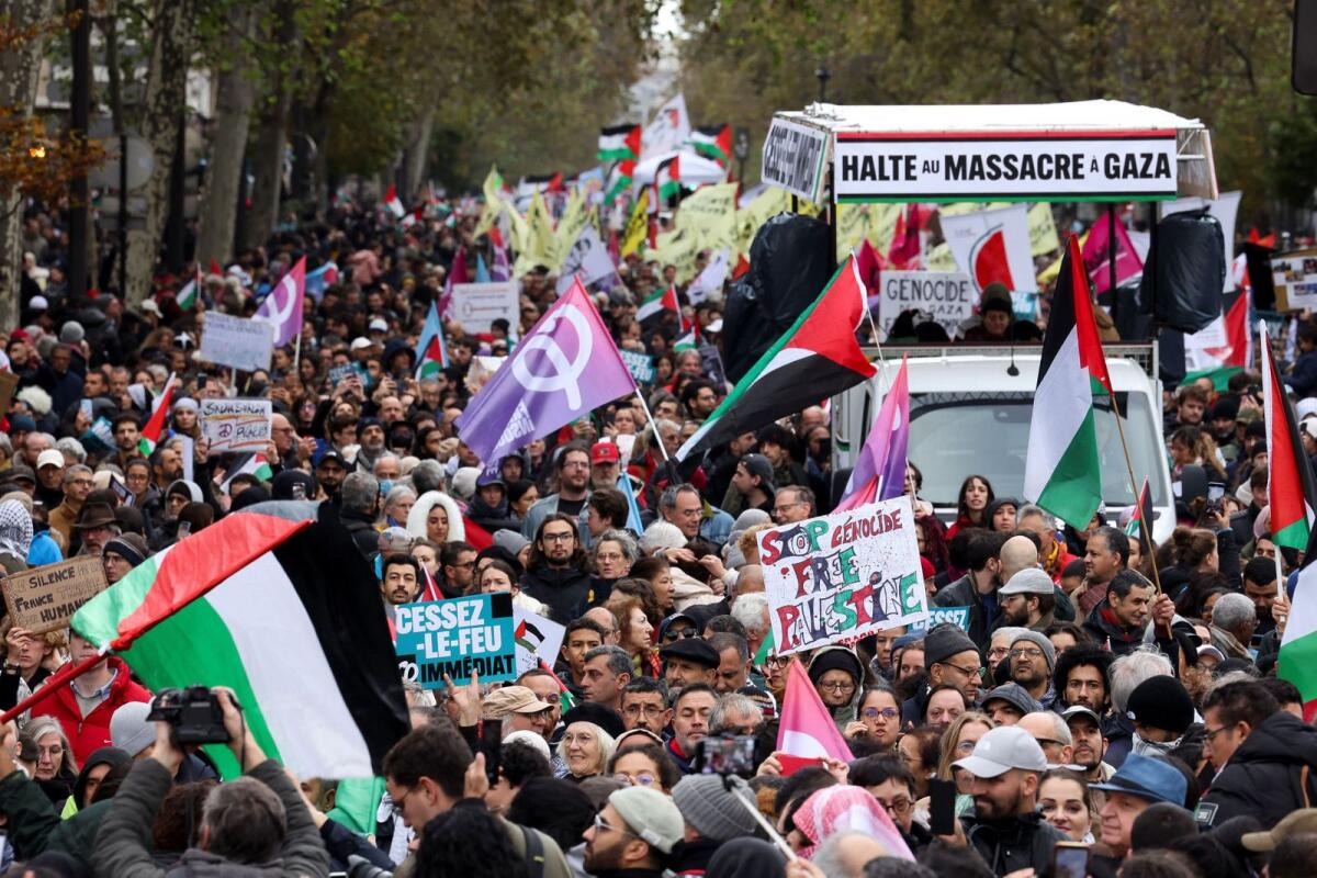 People attend a demonstration demanding a ceasefire in Gaza, an end to airstrikes and an end to 'forcible displacement of populations', amid the ongoing conflict between Israel and Palestinian Islamist group Hamas, in Paris, France, on Saturday. Photo: Reuters