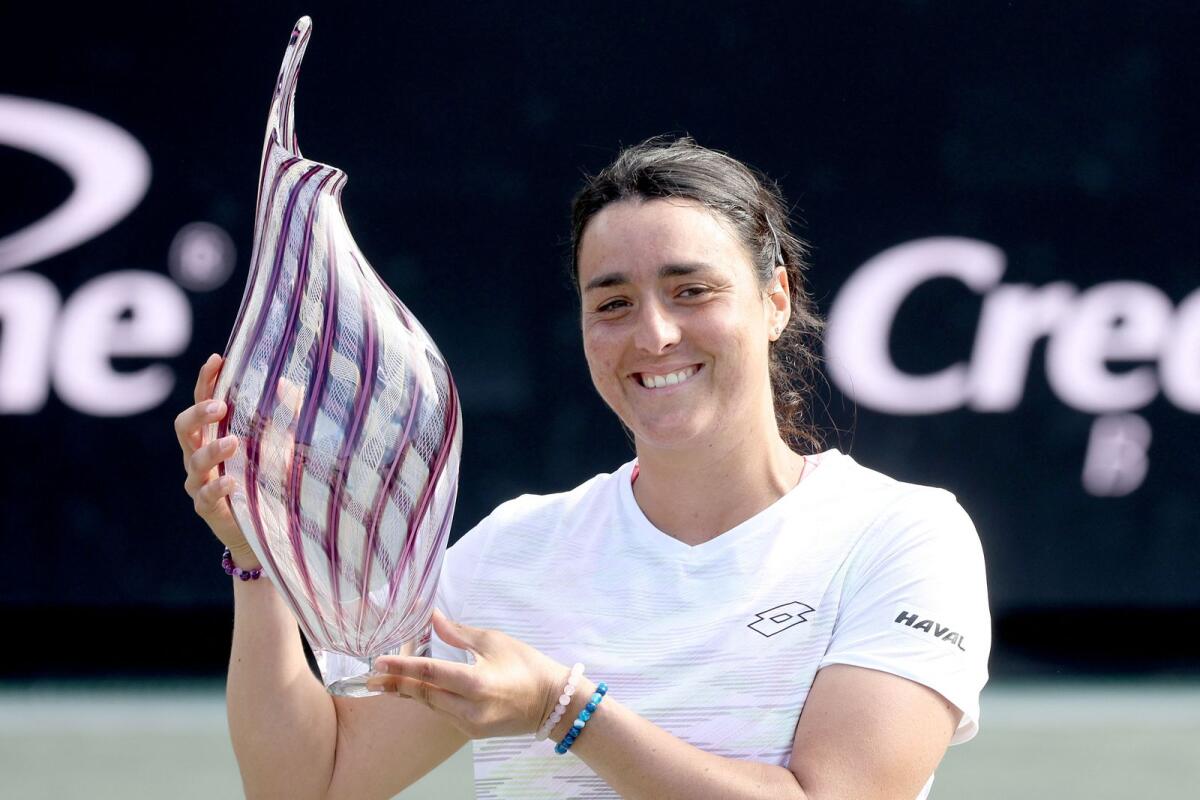 Ons Jabeur of Tunisia poses with the trophy after defeating Belinda Bencic of Switzerland. — AFP