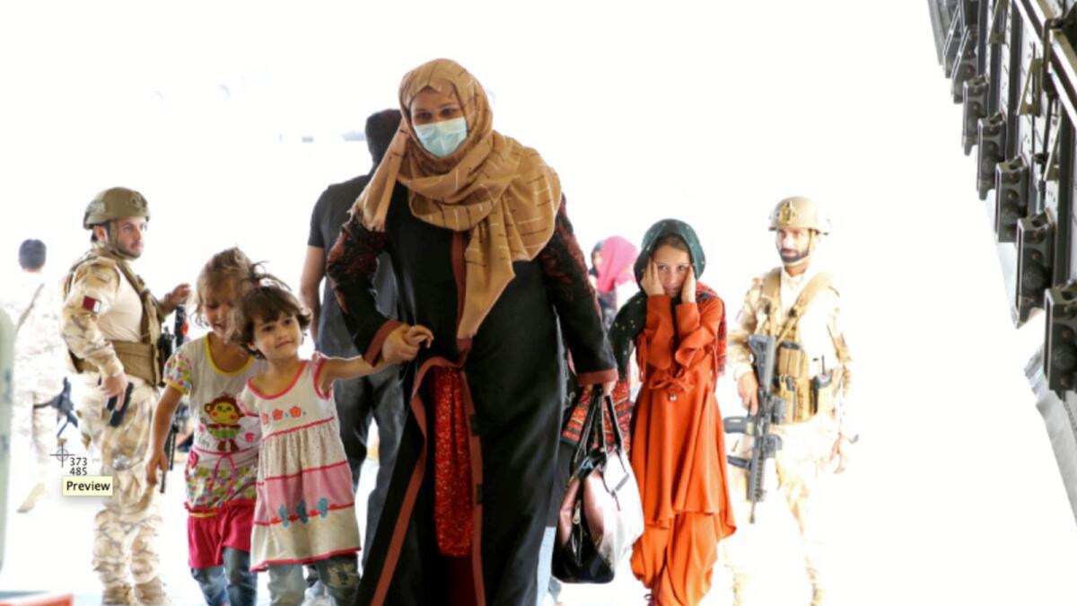 Afghans being evacuated in a Qatari plane last month at Kabul airport. — AP