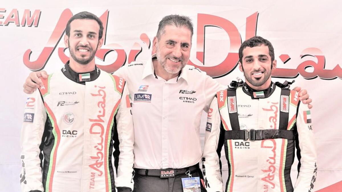 Rashed Al Qemzi and Mansoor Al Mansoori. with Guido Cappellini , the Team Principal of the Abu Dhabi Powerboat Team, - Supplied Photo