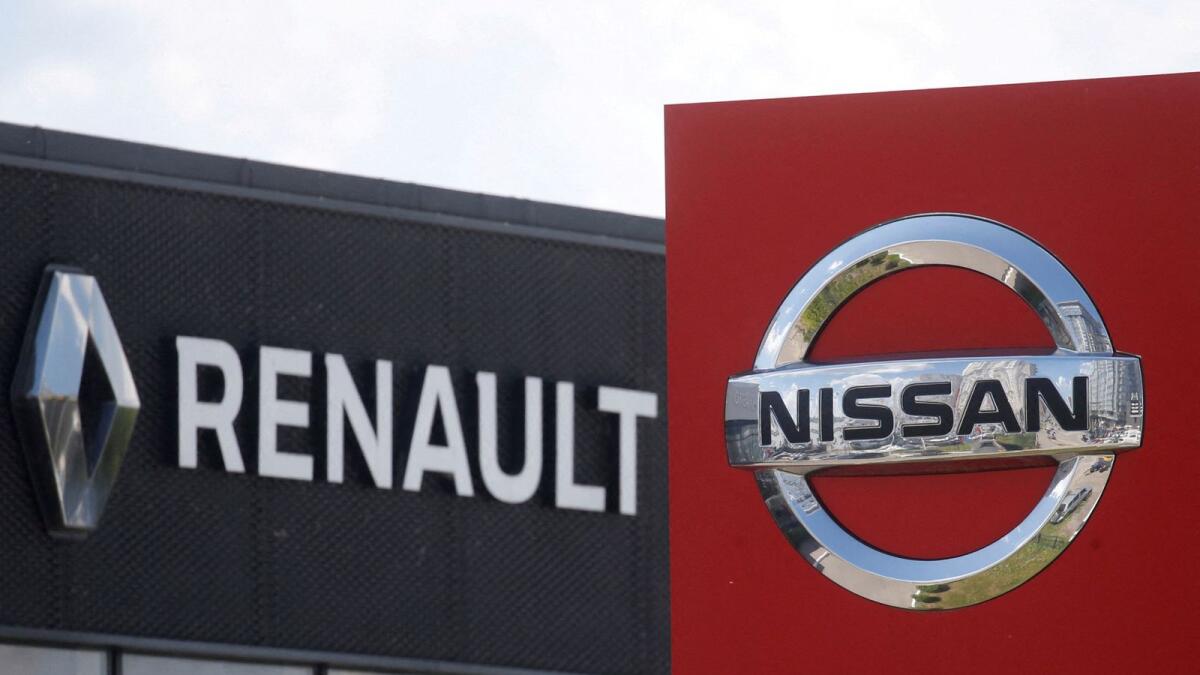 The logos of car manufacturers Nissan and Renault are pictured at a dealership Kyiv, Ukraine. — Reuters