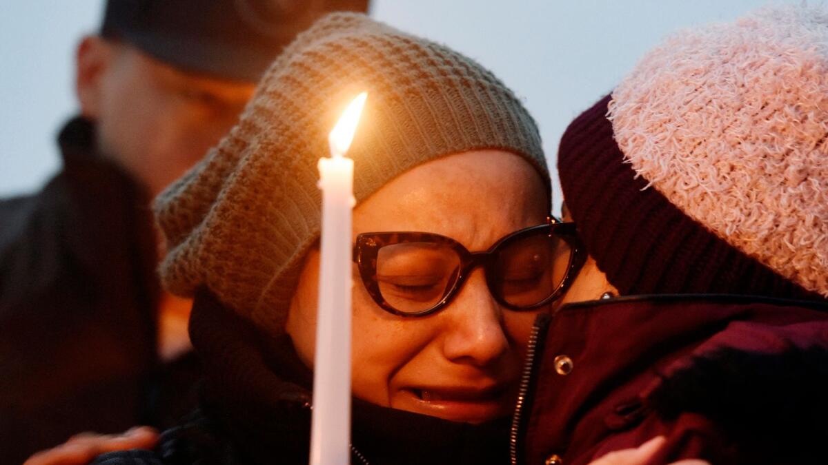 Norma Sanchez, mother of Valerie Reyes, grieves for her daughter during a candlelight vigil in Reyes' honour at Glen Island Park in New Rochelle, New York.