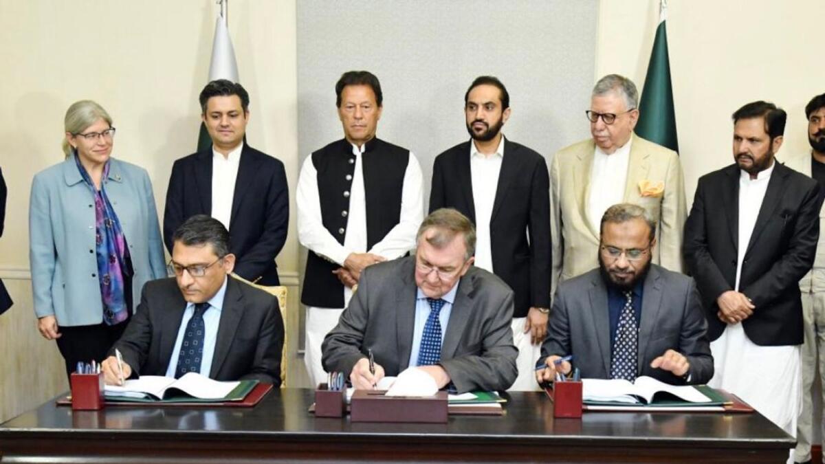 Pakistan Prime Minister Imran Khan and other officials during the signing of a deal to revive a mining project in Pakistan. — Courtesy: Twitter