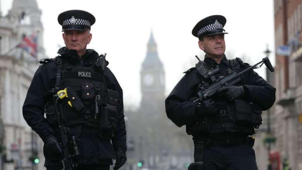 British police shoots woman, foils terrorism plot