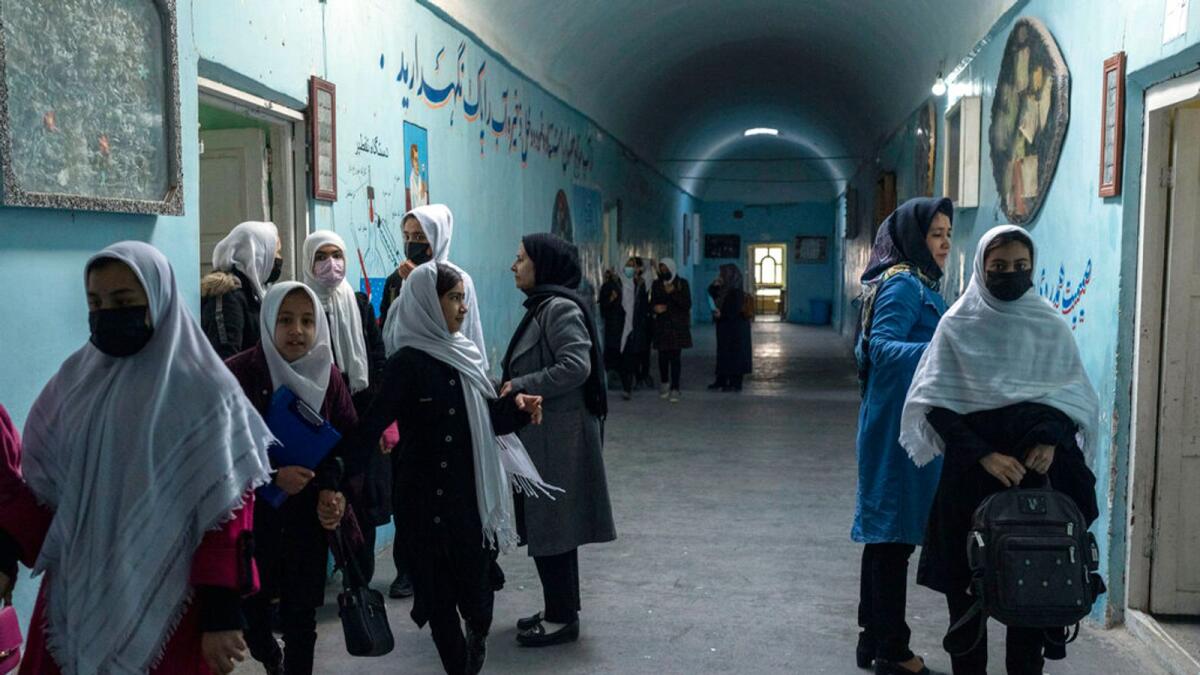Afghan girls exit classrooms at Tajrobawai Girls High School, in Herat, Afghanistan. While most high school girls in Afghanistan are forbidden to attend class by the country's Taliban rulers, one major exception are those in the western province of Herat. — AP file