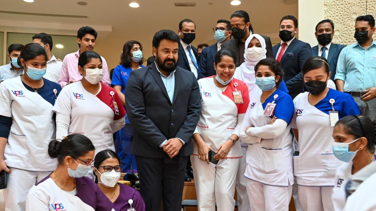 Mohanlal with nurses at Burjeel Medical City in Abu Dhabi. — Photo by Ryan Lim/Khaleej Times