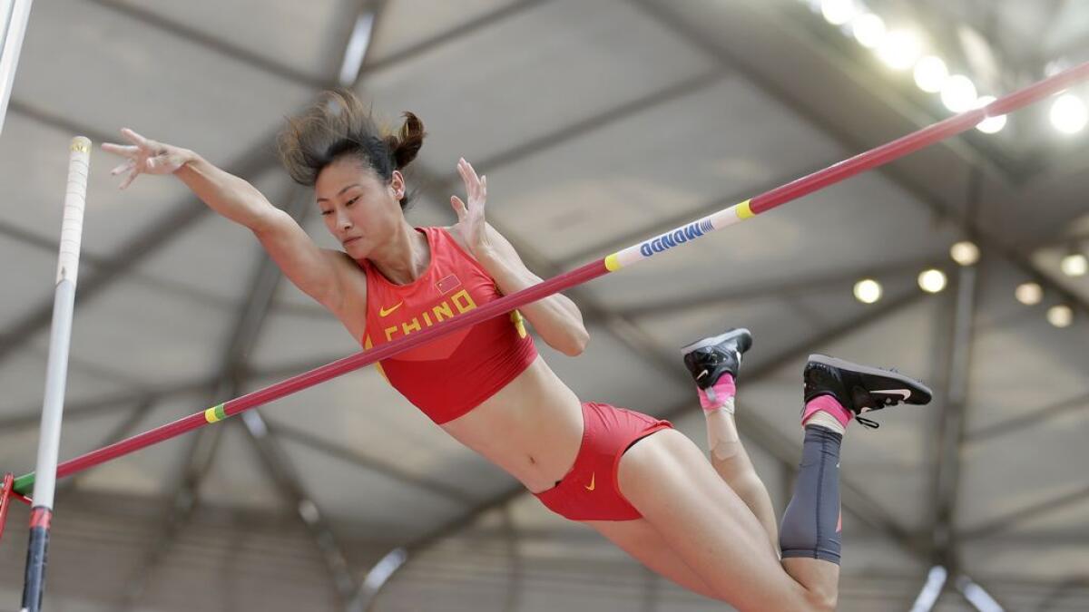 China's Li Ling makes a clearance in women's pole vault qualification at the World Athletics Championships at the Bird's Nest stadium in Beijing, on Aug. 24, 2015.  