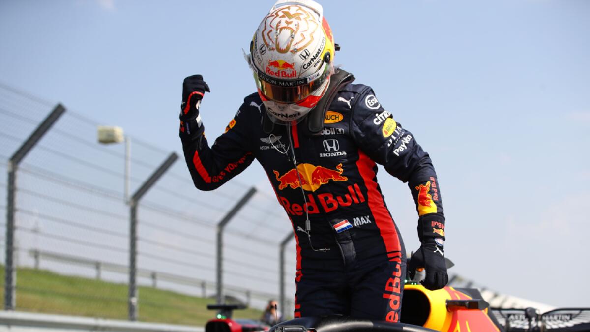 Red Bull's Dutch driver Max Verstappen celebrates after winning the race during the F1 70th Anniversary Grand Prix at Silverstone on August 9, 2020 in Northampton. The race commemorates the 70th anniversary of the inaugural world championship race, held at Silverstone in 1950. Photo: AFP