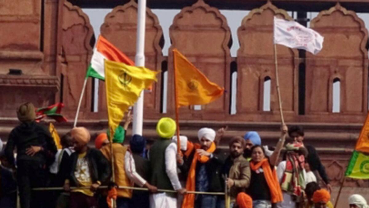Deep Sidhu (wearing white headgear) at the Red Fort during Indian farmers' protest on Republic Day. — File photo