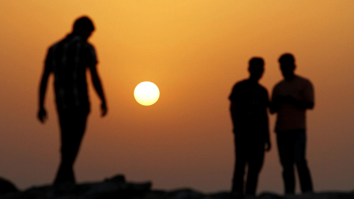 People are enjoying the sunset at the Ajman beach. – Photo by M.Sajjad/Khaleej Times