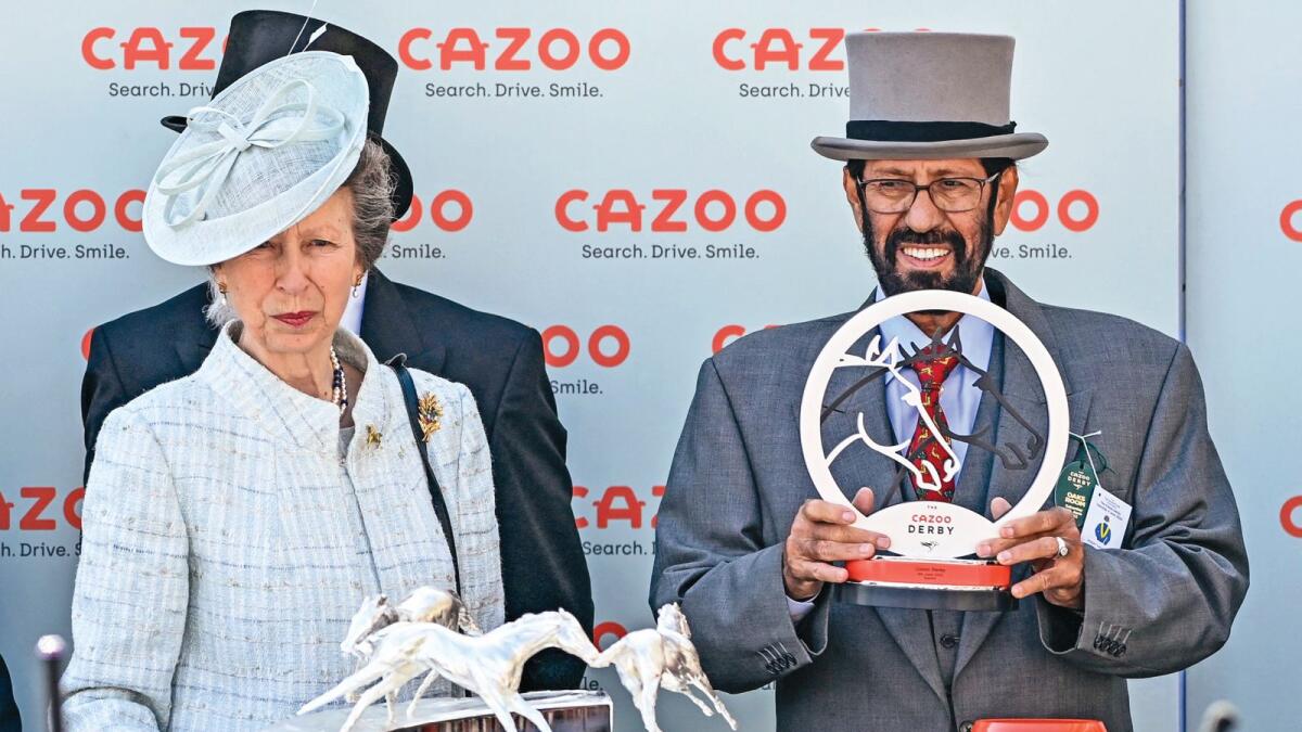 Britain's Princess Anne, Princess Royal (left), and winning owner of Desert Crown, Saeed Suhail at Epsom Downs Racecourse on Saturday. — AFP