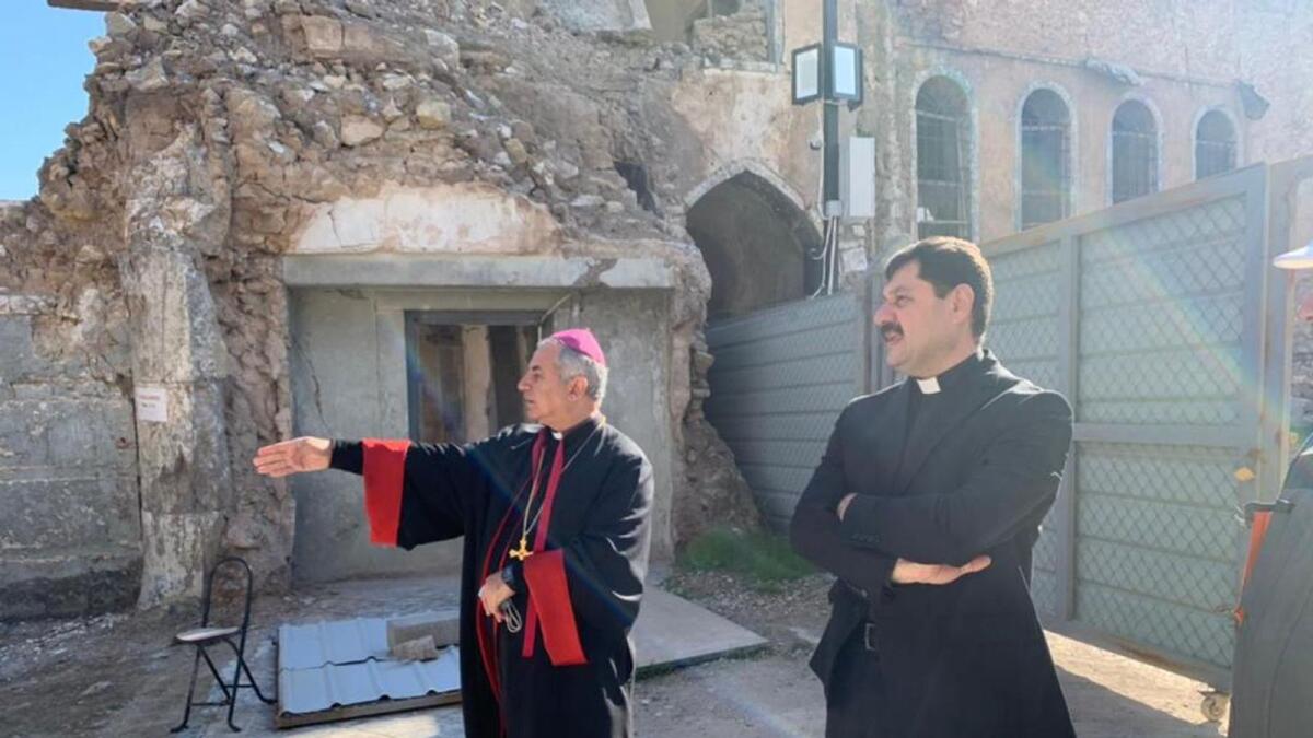 Father Michaeel, the Archbishop Chaldean of Mosul, overseeing the renovation work at his church.