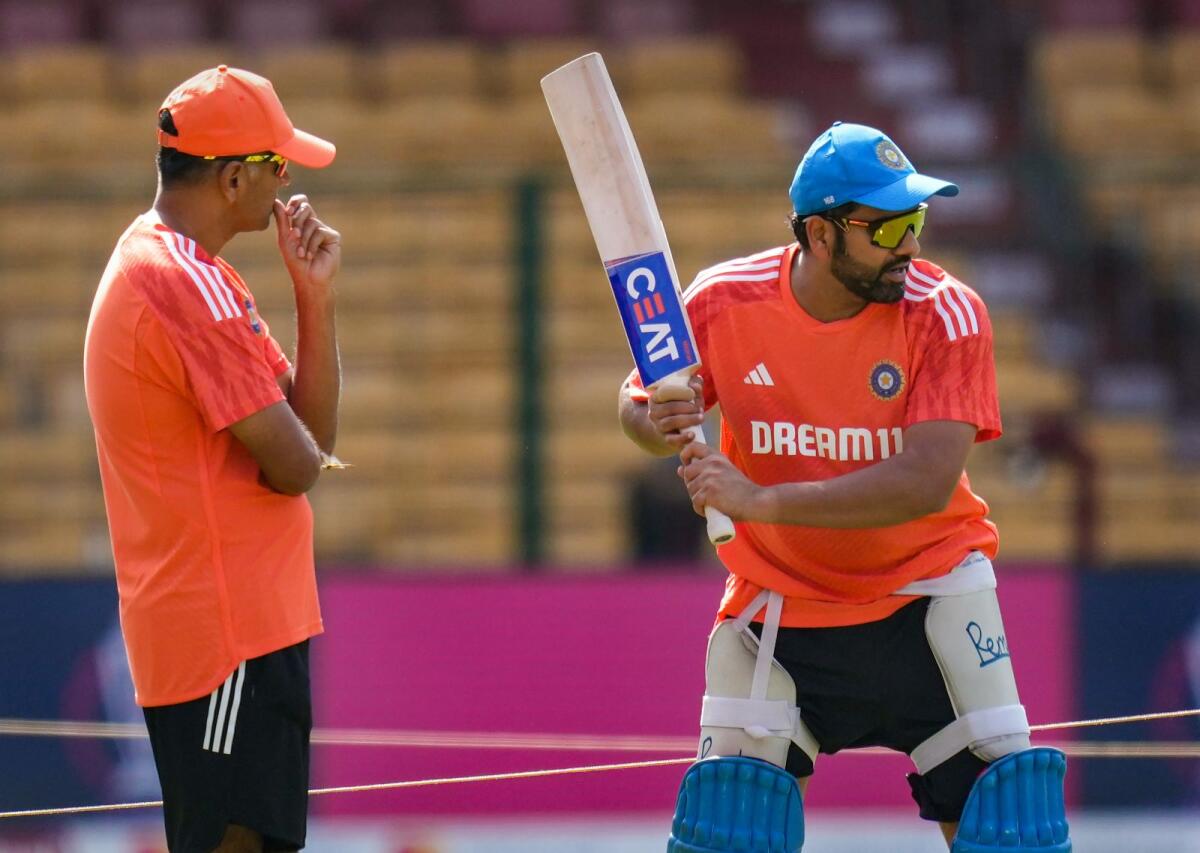 India's captain Rohit Sharma and head coach Rahul Dravid during a practice session. — PTI