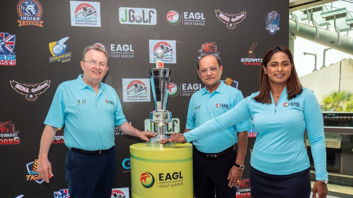 Priyaa Kumaria (right), Sudesh Aggarwal and Nick Tarratt (left) with the the Emirates Amateur Golf League trophy. (Supplied photo)
