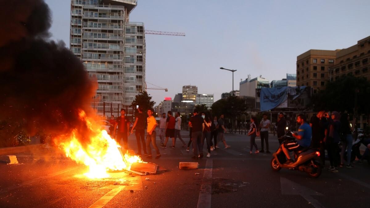 Lebanese, protests, fires, Beirut, currency, collapse, economic, hardship