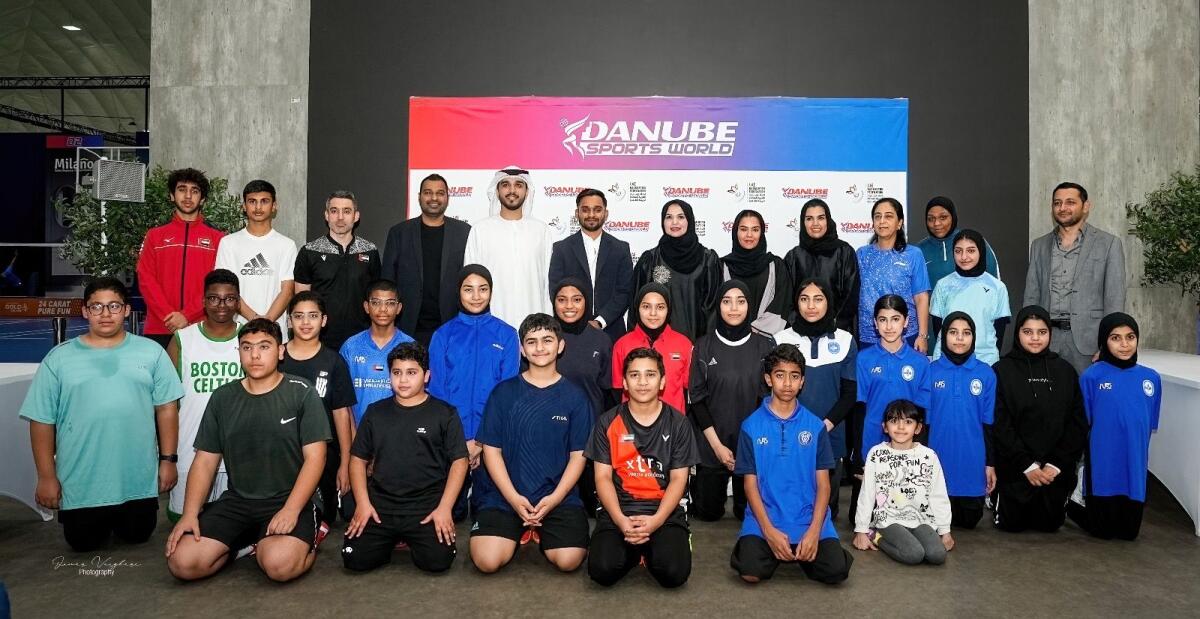 Young shuttlers with officials. — Supplied photo