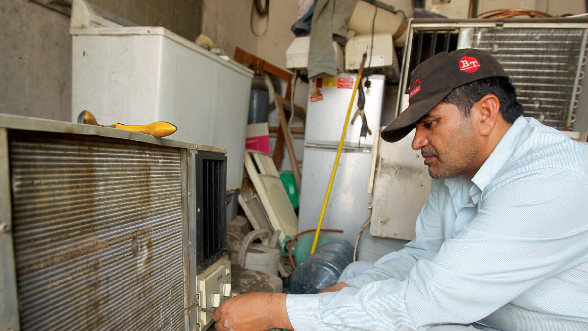  CONDITIONED LIFE ... AC servicing and repairing gains supreme importance.- Photo by Rahul Gajjar/ Khaleej Times 